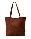 Handmade leather tote bag with strap closure