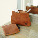 Handmade leather goods high quality leather pouch makeup bag with products inside